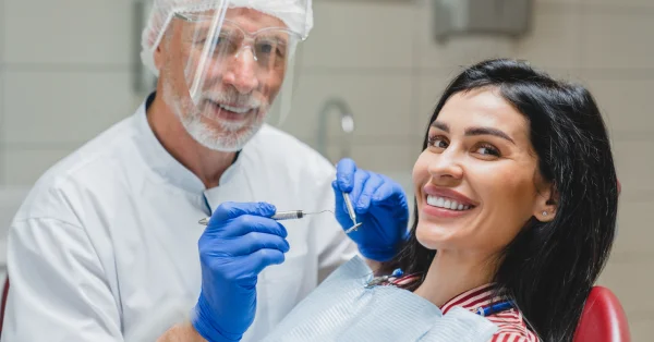 Happy patient with dentist during cosmetic dentistry in San Francisco appointment